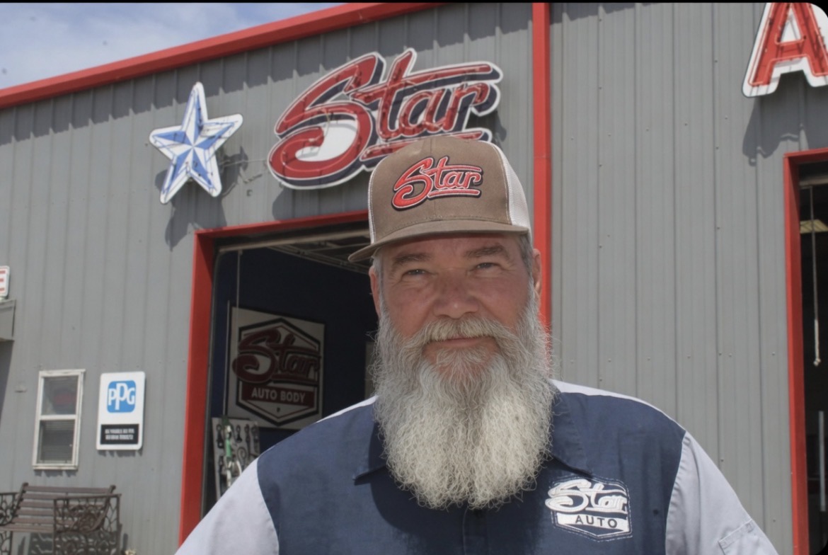 Bobby Ritchie, owner of Star Auto Body, outside the shop in Howe, TX
